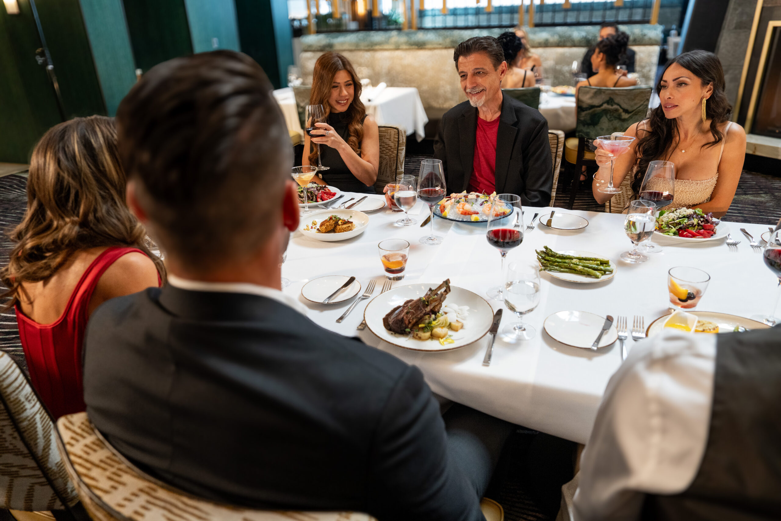 Guests enjoying dinner at The Grove Steakhouse